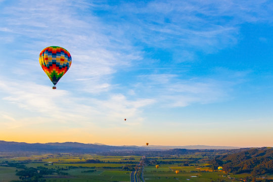 Hot Air Balloon Over Vineyards At Sunrise Over Napa Valley, Napa, California USA