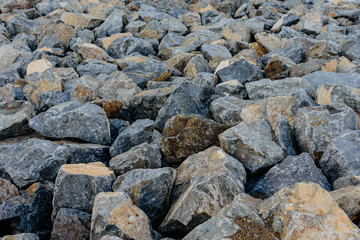 Fototapeta na wymiar pile of large rocks from storm control drain