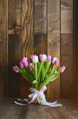 bouquet with tulips  on wooden background