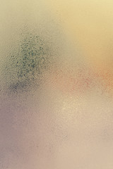 Fototapeta na wymiar Sunny foggy window glass blurry condensation background, closeup image