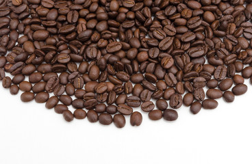 Roasted coffee beans on white.