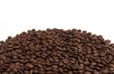 Roasted coffee beans on white.