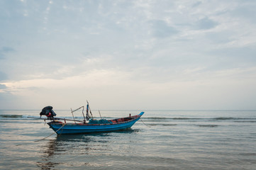 Naklejka na ściany i meble Beach and tropical sea with long-tail boat in thailand