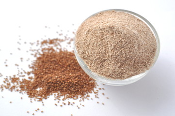 Teff grain from Africa. Smallest grain in the world. Alternative gluten-free flour for baking and cooking. Isolated on white 
