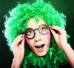 crazy woman over green background