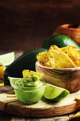 Corn nachos and avocado sauce, selective focus