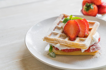 waffle with strawberry on wood