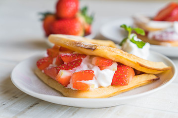 waffle with strawberry on wood