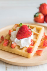 waffle with strawberry on wood