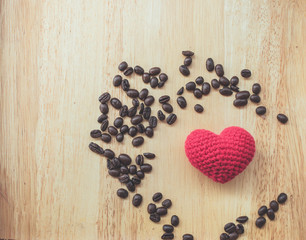 coffee bean and coffee mug on wood background