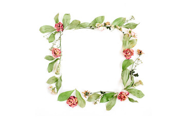 Round frame wreath pattern with roses, pink flower buds, branches and leaves isolated on white background. Flat lay, top view