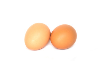 Two brown chicken egg isolated on white background.