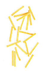 Potato sticks falling on white background.