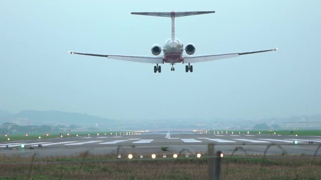 Slow motion Jet Airplane Take Off Landing Or Parking At national Airport. A Commercial Passenger Aircraft arrival. Plane fly in day time. Slow-motion rate 120 fps-Dan