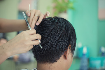 a man cutting hair  at barber