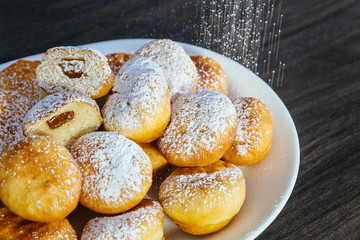 a lot of donuts on the counter in a supermarket