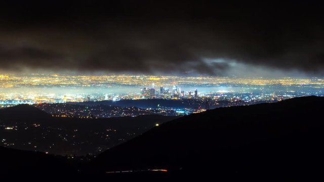 Timelapse of Storm Clouds over Los Angeles City Lights -Tilt Up-