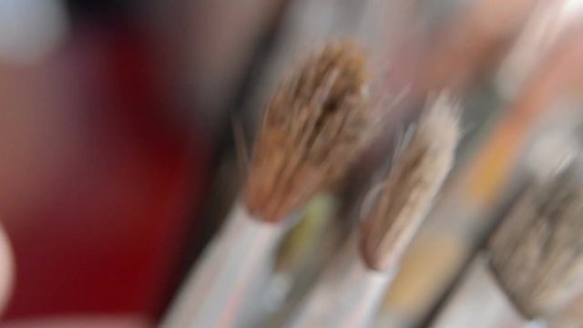 A lot of different brushes close up.