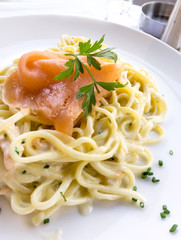 tasty pasta with salmon on a the table