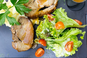 pork chop-delicious juicy pork chop with mash potatoes in black slate