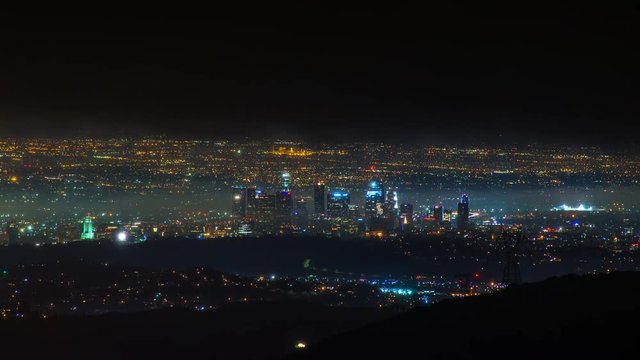 Timelapse of Los Angeles Skyline at night in Storm Clouds