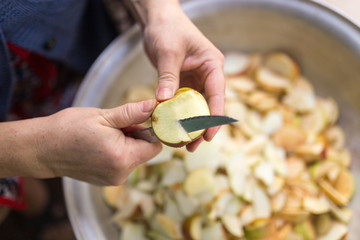cutting an apple with a knife