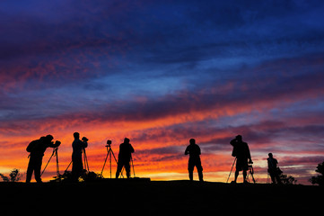 Fototapeta premium Silhouettes of photographers