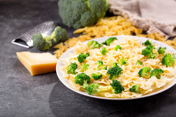 plate of pasta with broccoli and parmesan