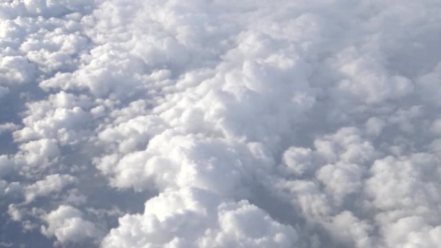 4K Hd Ultra, Traveling by air. Wonderful view of the sky and clouds with the light the sun from above, as seen through an airplane window-Dan