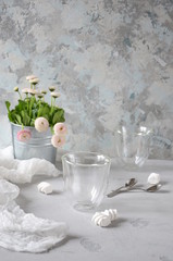 Morning coffee or cup of tea with pink flowers on  white rustic table. Selective Focus.