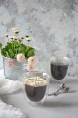 Morning coffee or cup of tea with pink flowers on  white rustic table. Selective Focus.