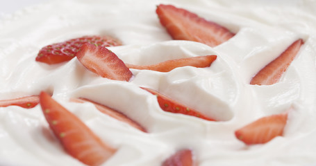 fresh sliced straberries in cream background