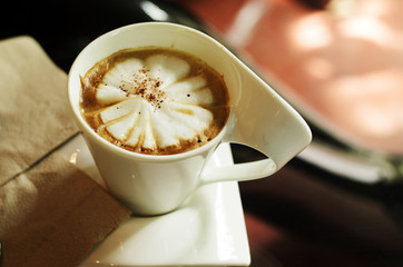 close up of cappuccino with milk foam in coffee shop backgrounds