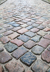 Old colorful shining cobblestone road