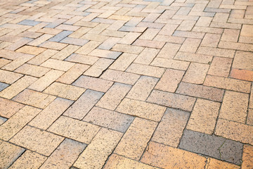 Yellow cobblestone road pavement texture