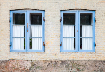 Fototapeta na wymiar Texture of windows in blue wooden frames