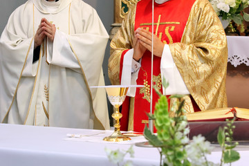 Two priests celebrate mass at the church