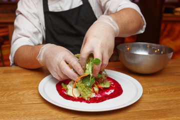 Chef is making vegetable appetizer