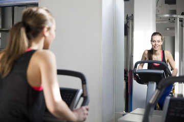 Young woman exercise on the treadmill at the gym