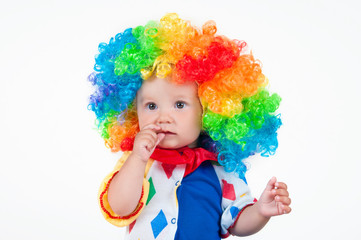 Child clown with a red nose multicolored wig in with balls