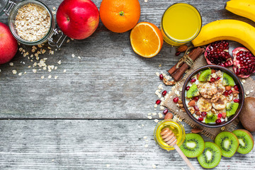 oatmeal porridge with fruits, nuts and spices with orange juice