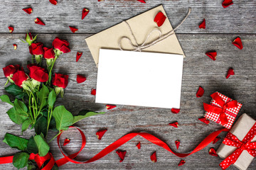 blank white greeting card and envelope with red roses flowers