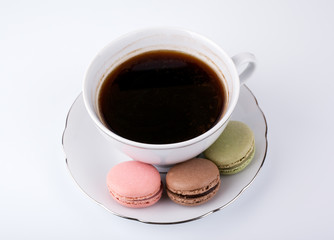 Coffee mug and Cake macaron on white background, sweet and colorful dessert.