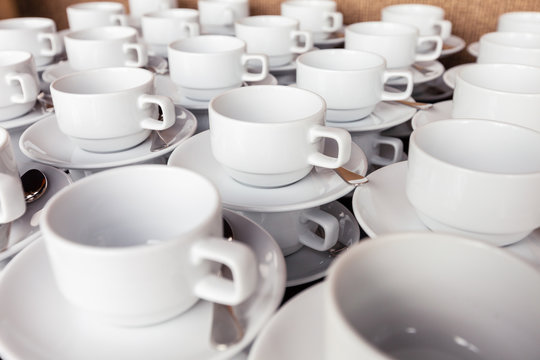 Many white cup prepared for coffee break during seminar event.