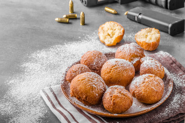 Homemade donuts with sugar and gun