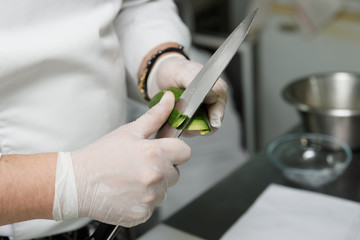 Chef is peeling avocado