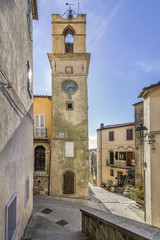 Fototapeta na wymiar The ancient Clock Tower in the historic center of Manciano, Grosseto, Tuscany, Italy