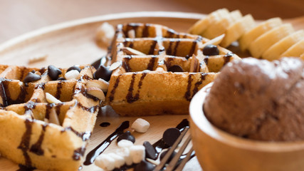Belgian waffles with fruit and chocolate, forest fruit, all homemade, delicious batter.