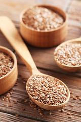 Brown flax seeds on a wooden table