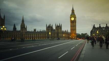 Fototapeta na wymiar LONDON, UK - APRIL: Traffic and pedestrians on Westminster Bridge near Big Ben and Parliament